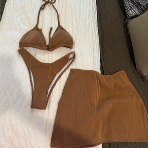 NWOT, never worn bikini size small with matching sarong skirt